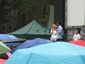 John Stamos and Christine Nagy on stage at Broadway in Bryant Park
