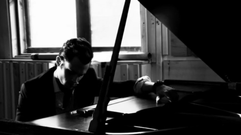 Penn Badgley plays piano during Bullett Magazine photoshoot
